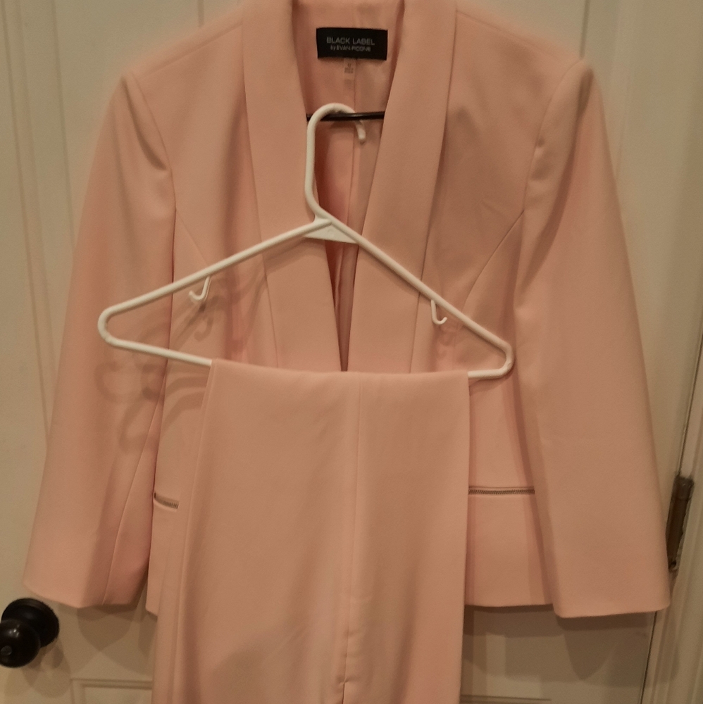 Pink suit, only wore once to son's wedding.